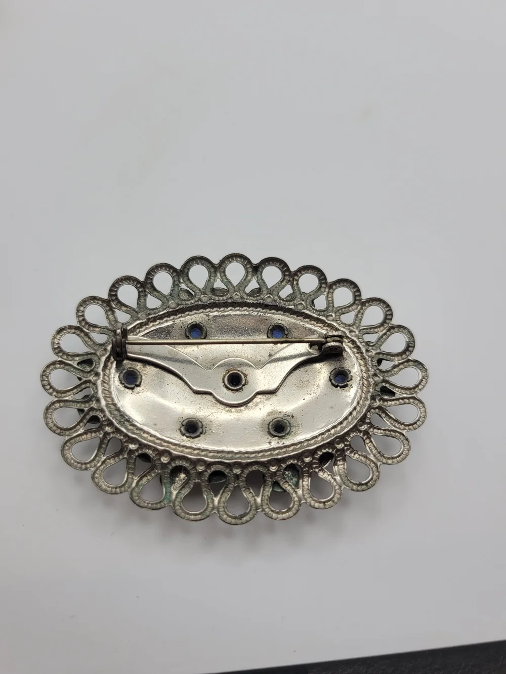 Vintage-Inspired Silver Floral Brooch with Blue Crystal Accents